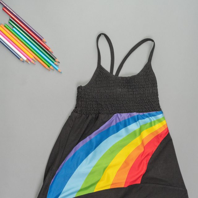 Black up down frock with rainbow print for girls by ten and below